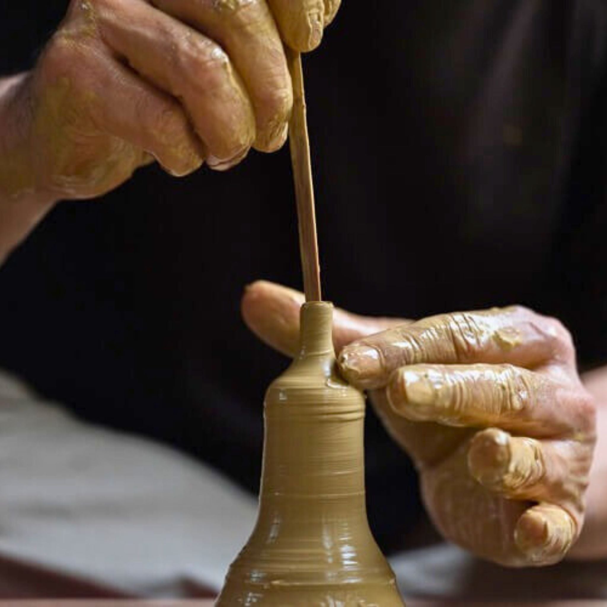 Artisan creating Japanese teapot