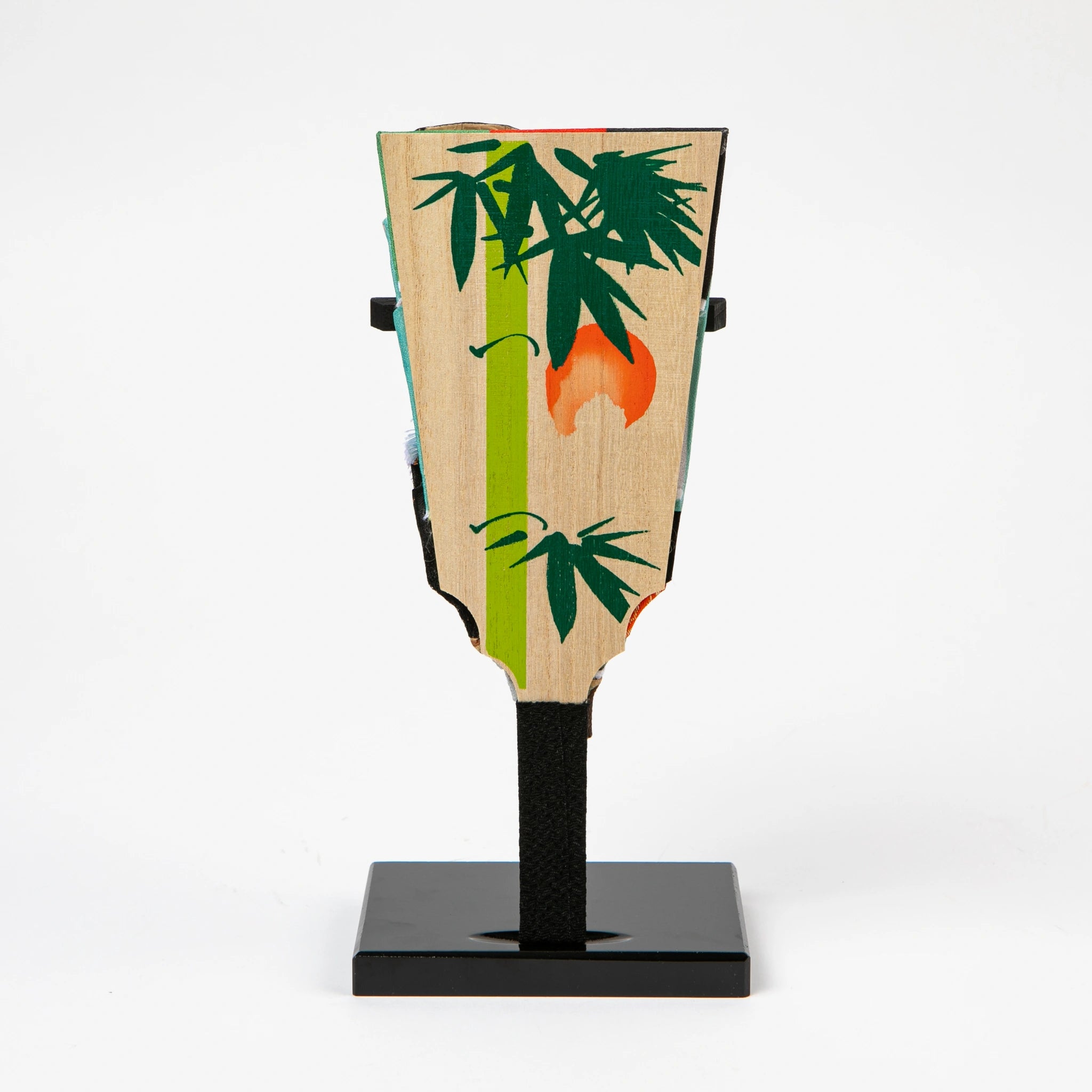 Wooden backside of the hagoita painted with a bamboo and red sun motif, highlighting traditional Japanese aesthetics.