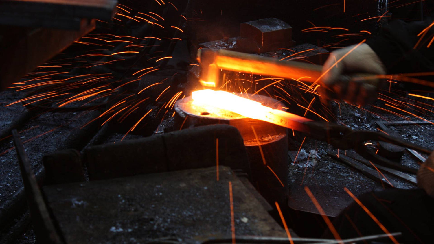 Japanese blacksmith forging Kakuri chisel