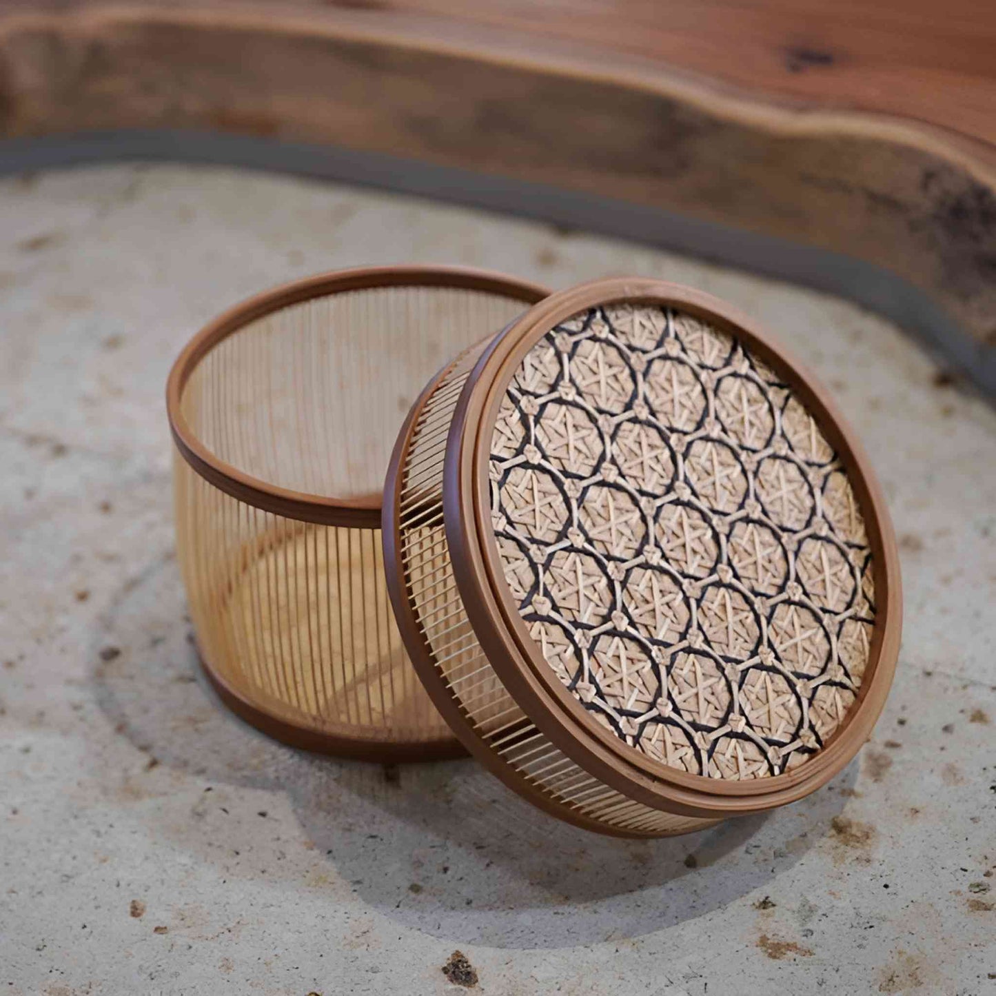 Bamboo basket with an intricate hexagonal weave lid and smooth vertical bamboo strips along the sides, reflecting traditional Japanese weaving techniques.