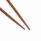 Detailed view of the tapered tips of the chopsticks highlighting their smooth and polished finish.