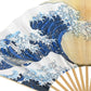 Detailed section of the fan showcasing the massive blue wave with intricate white foam, capturing the dynamic motion of the artwork.