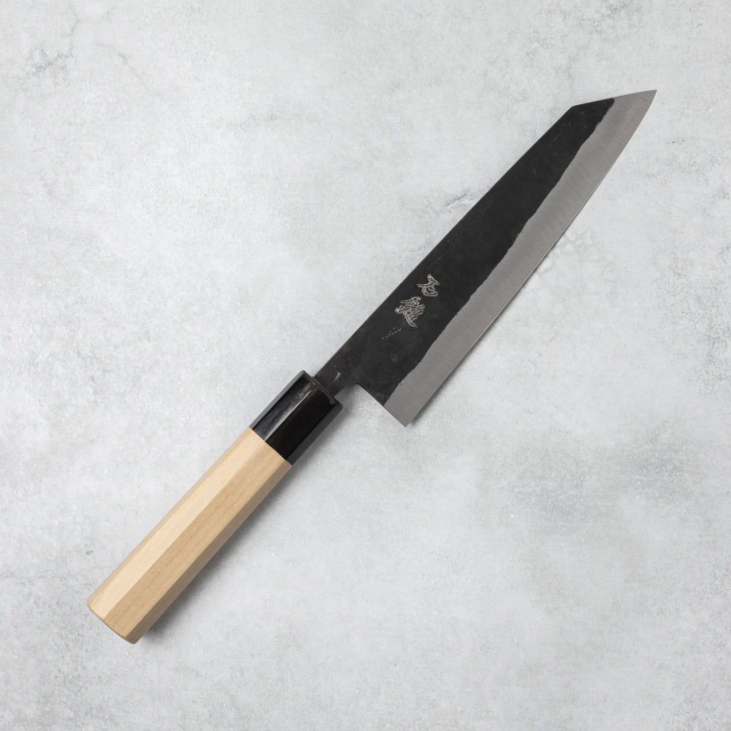 Full view of the Ishizuchi Blue Steel No.2 Kiritsuke Knife with magnolia handle, highlighting its elegant and precise kiritsuke blade on a light background.