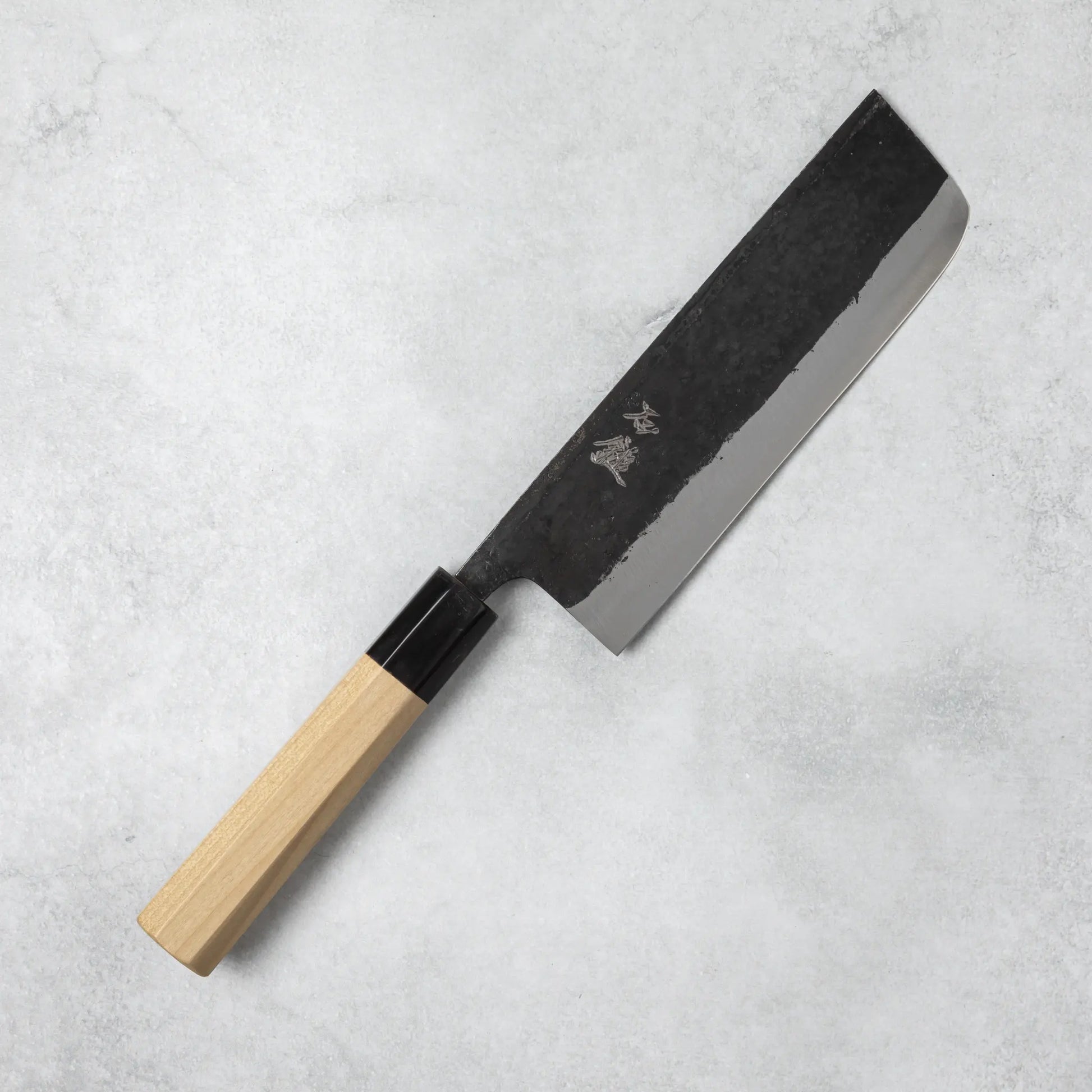 Full view of the Ishizuchi Blue Steel No.2 Nakiri Knife with magnolia handle, featuring a rectangular blade perfect for precise vegetable cuts.