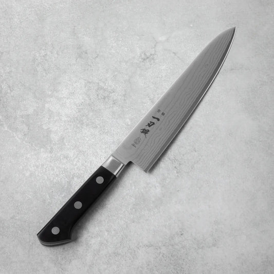 A side view of the Ittoutan Kiageha chef’s knife, showing its full length and balanced design.