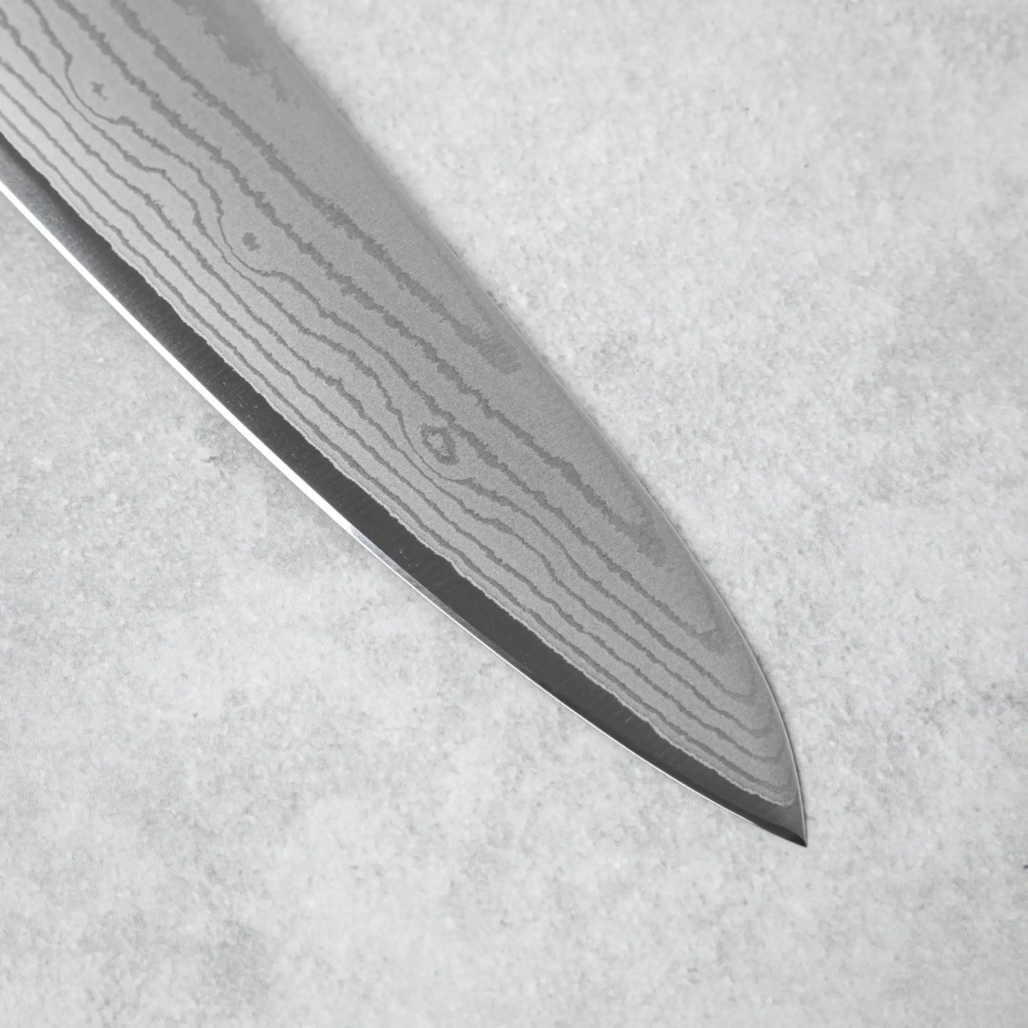 A detailed shot of the razor-sharp blade edge, highlighting the precise craftsmanship.