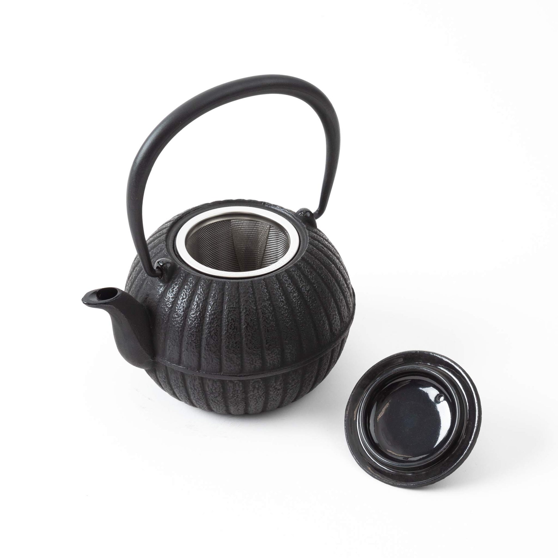 Japanese Aster Black Nanbu Cast Iron Teapot with lid removed, revealing the interior and stainless steel infuser basket.