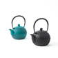 Japanese Aster Nanbu cast iron teapots in sky blue and black colors, both featuring ribbed patterns and traditional Japanese craftsmanship.