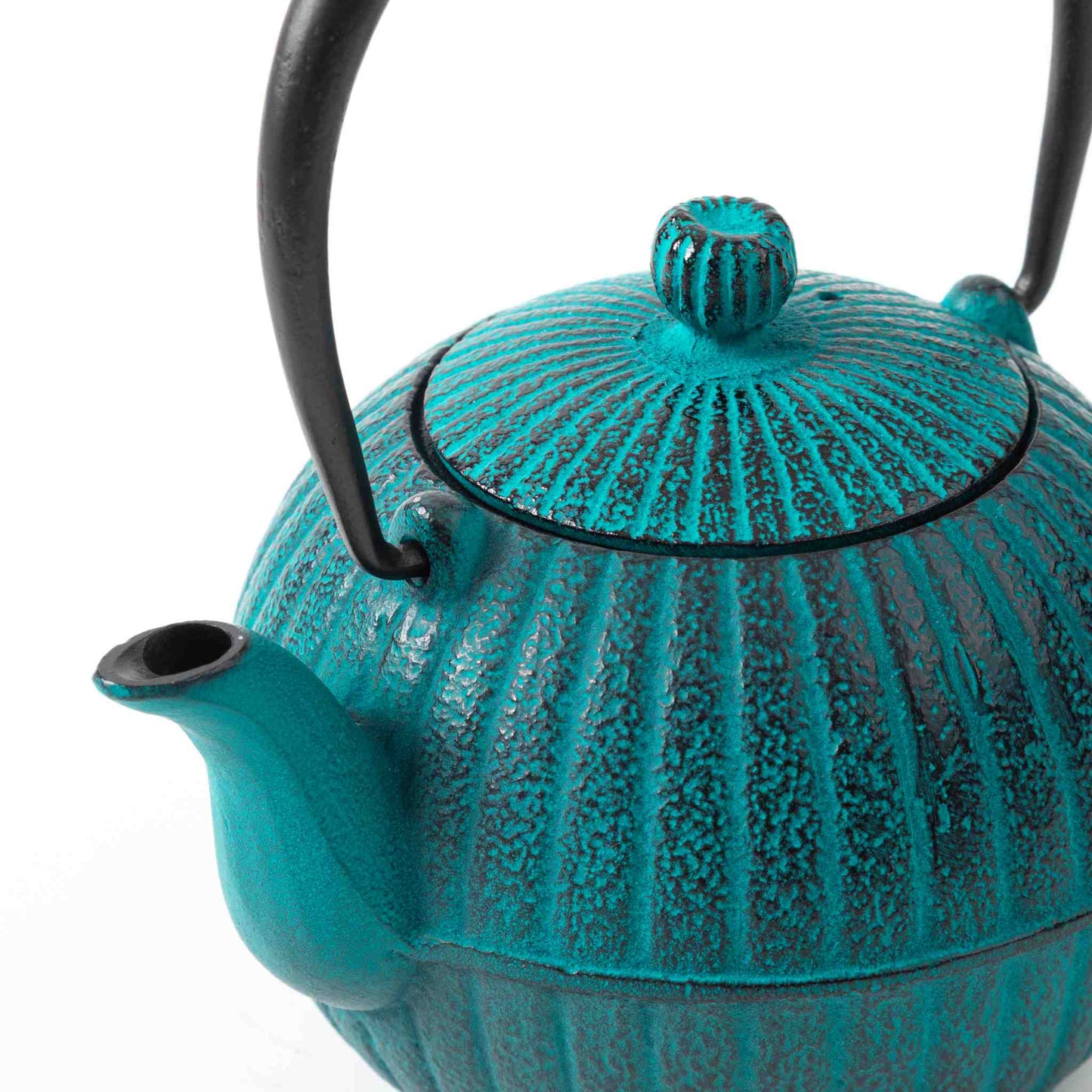 Close-up of the Japanese Aster sky blue Nanbu cast iron teapot, showcasing the lid details and fine craftsmanship.