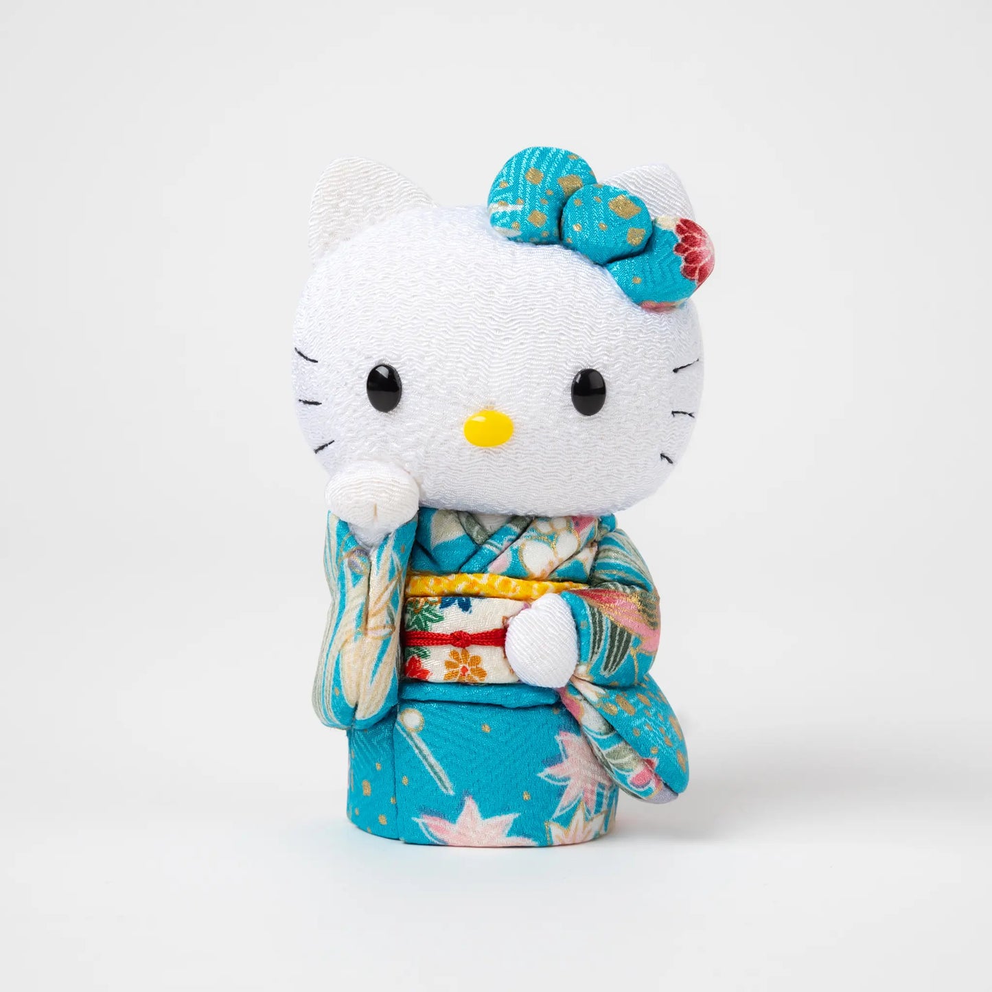 Front view of the Edo Kimekomi Kimono Maneki Hello Kitty Blue, featuring Hello Kitty in a traditional Japanese kimono with a blue and floral pattern and a decorative bow on her head.