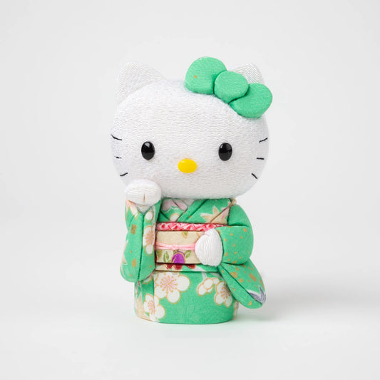 Front view of the Edo Kimekomi Kimono Maneki Hello Kitty Green, featuring Hello Kitty in a traditional Japanese kimono with a green floral pattern and a decorative bow on her head.