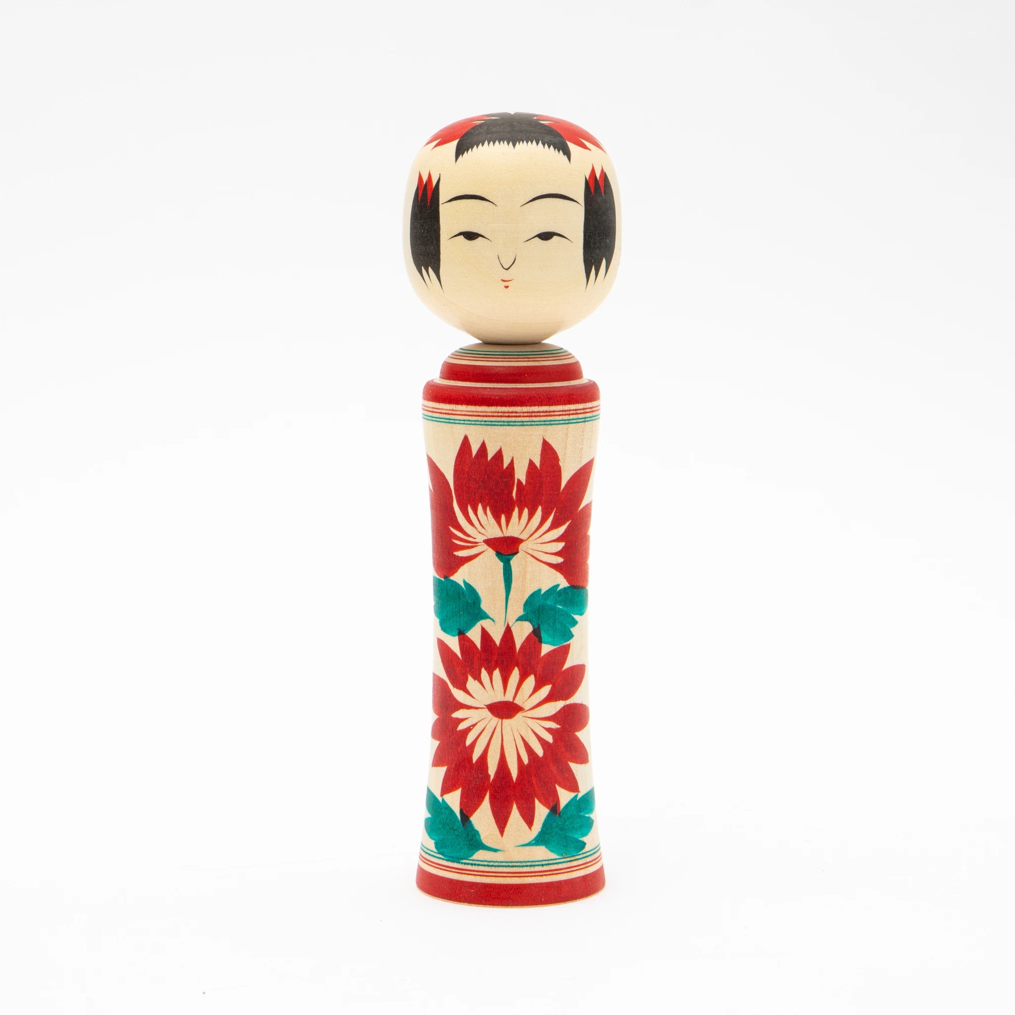 Front view of an 18cm Naruko style kokeshi doll by Kakizawa Kokeshi Studio, showing a cylindrical pale wood body hand-painted with large red chrysanthemums and teal leaves, and a rounded head with black fringe detail and composed facial features.