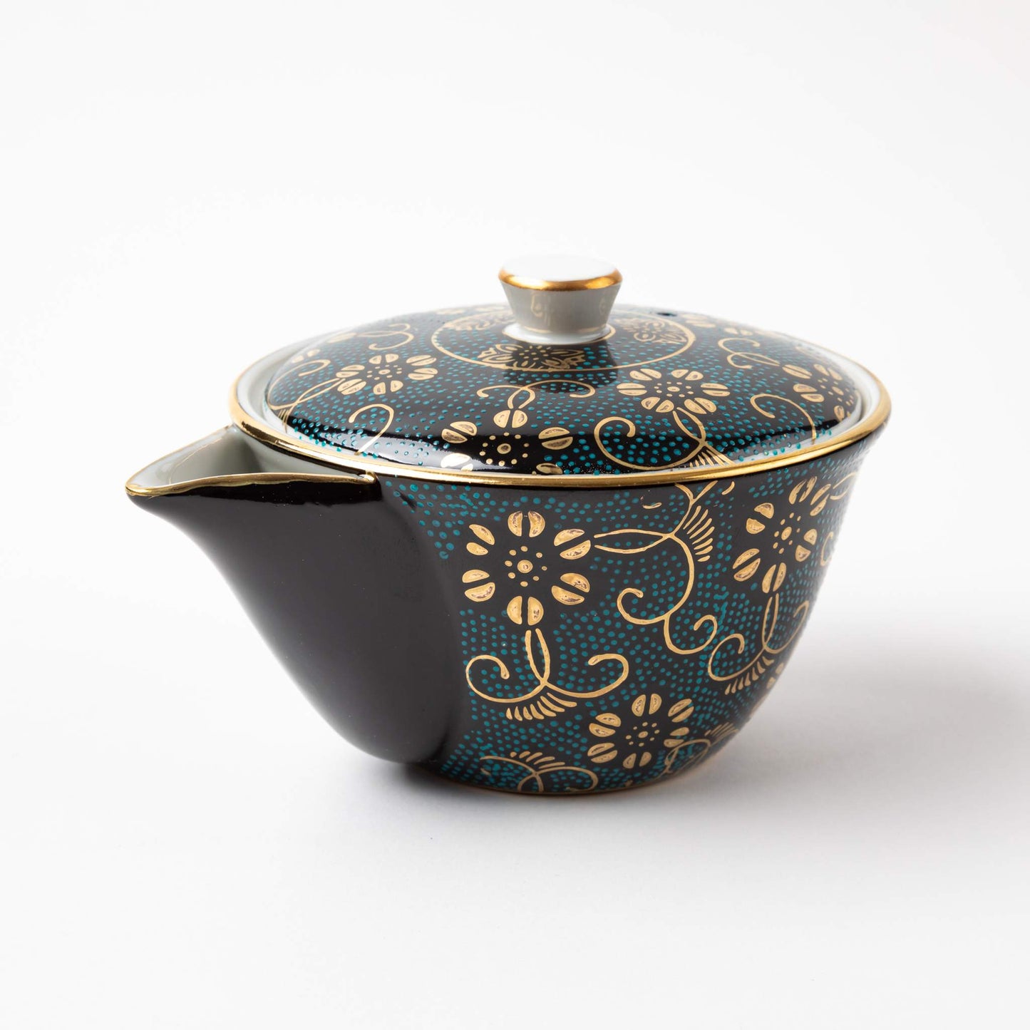 Kutani Aochibu Tessen teapot with a dark blue base, adorned with intricate gold floral patterns and a dotted turquoise background, featuring a small spout and a fitted lid.