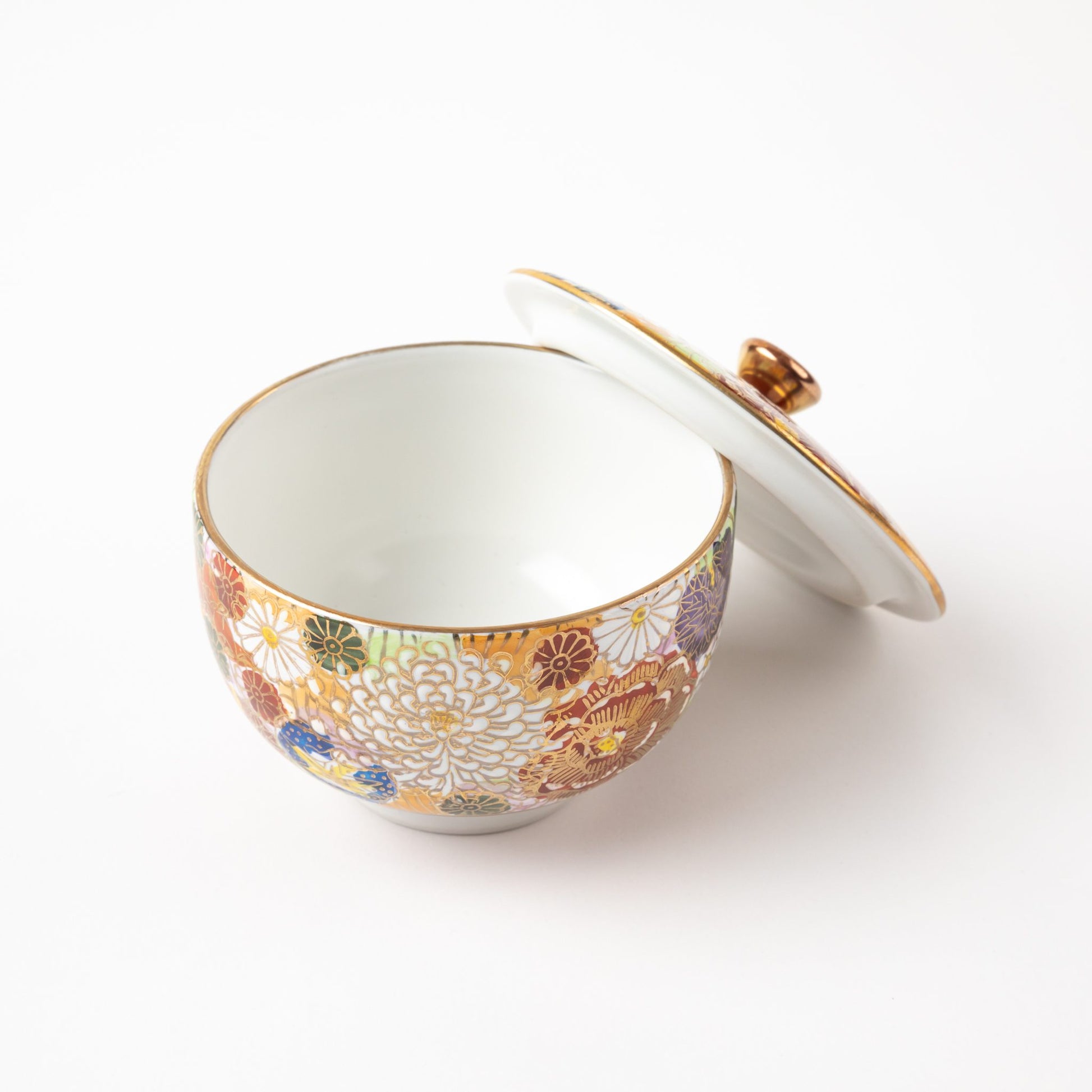 Inside view of a lidded tea cup from the Kutani Blooming Flowers Tea Set, featuring detailed floral motifs.