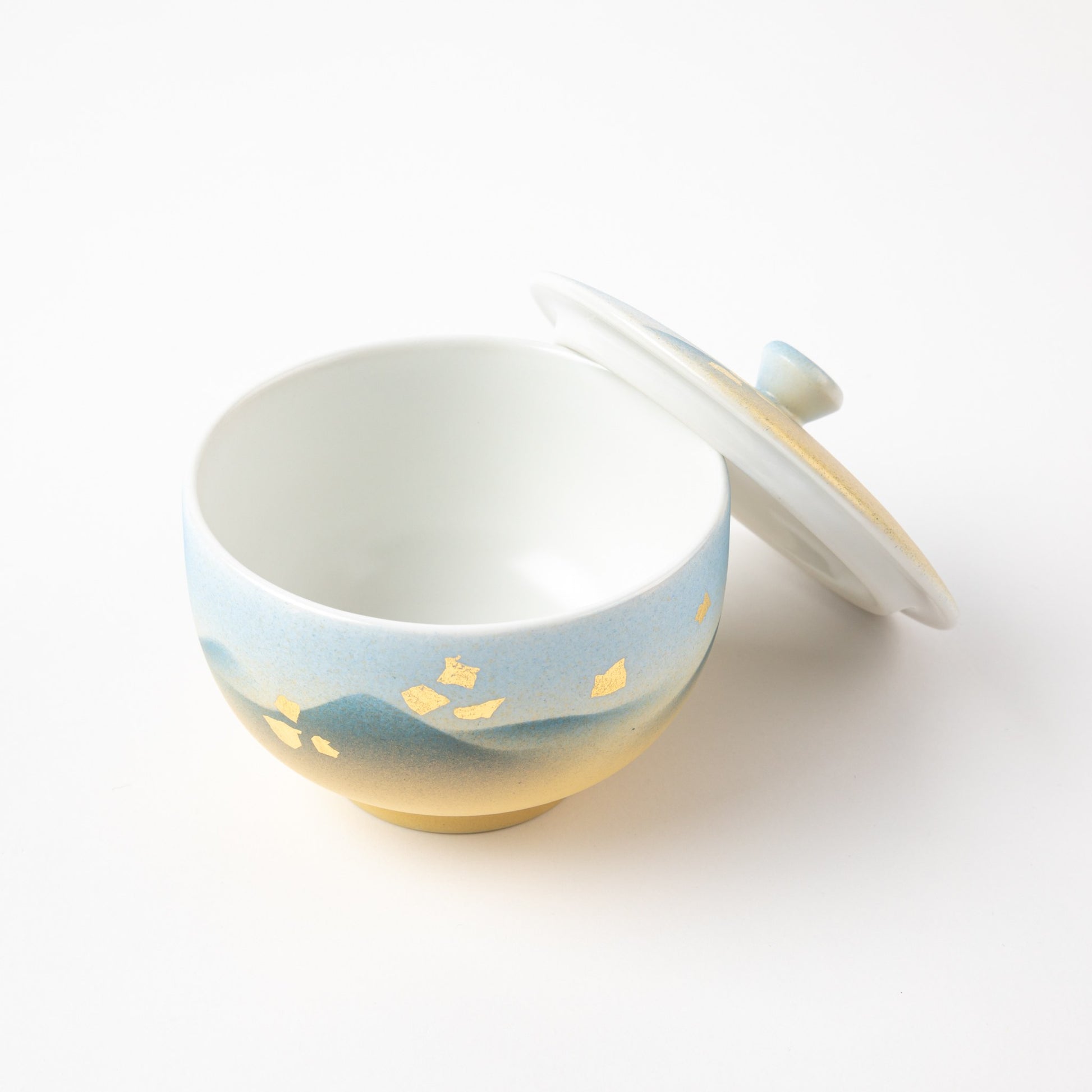 Kutani Mountain Range tea cup with lid featuring blue and yellow mountain design and gold leaf embellishments