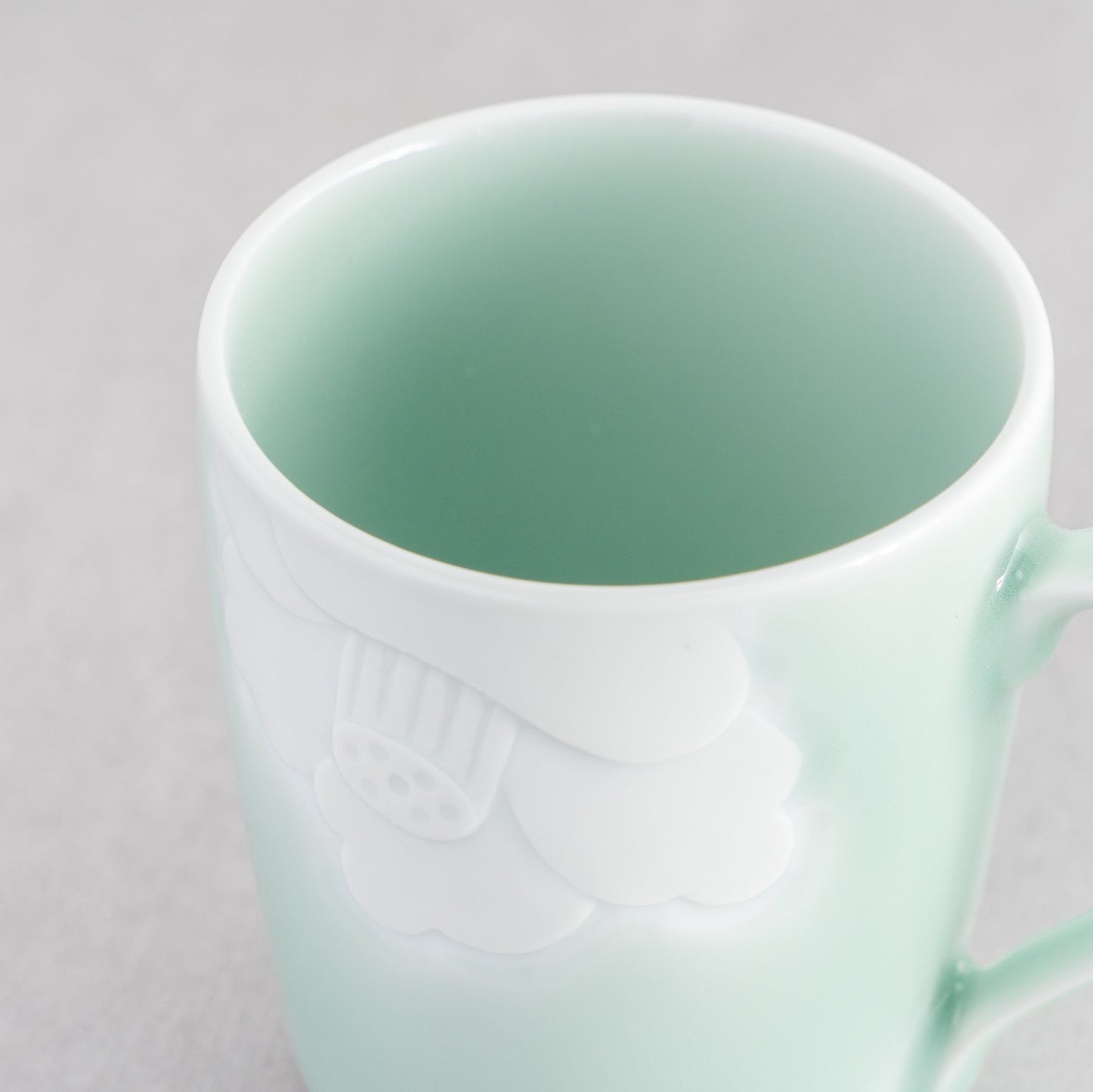 Nabeshima Celadon Porcelain Camellia Carved Mug