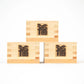 Three stacked masu cups featuring 'Fuku' (fortune) engraved on the front