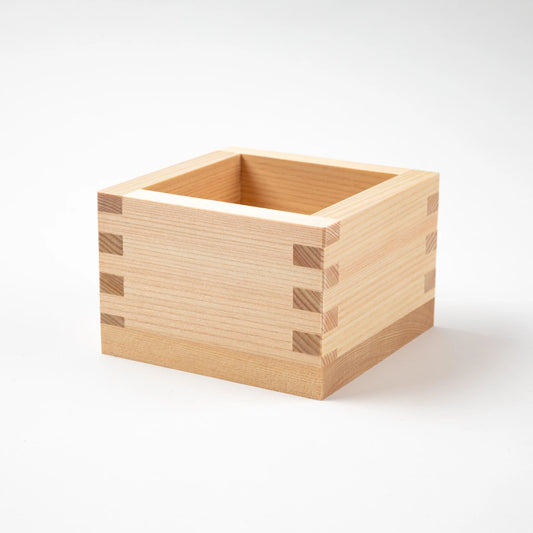 Minimalist plain wooden masu cup with a smooth natural finish