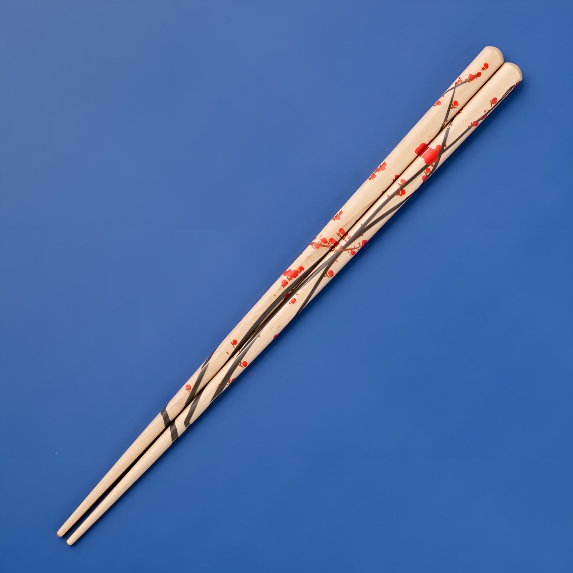 Natural wood chopsticks featuring a black and red plum blossom design with delicate red flowers on flowing black branches.