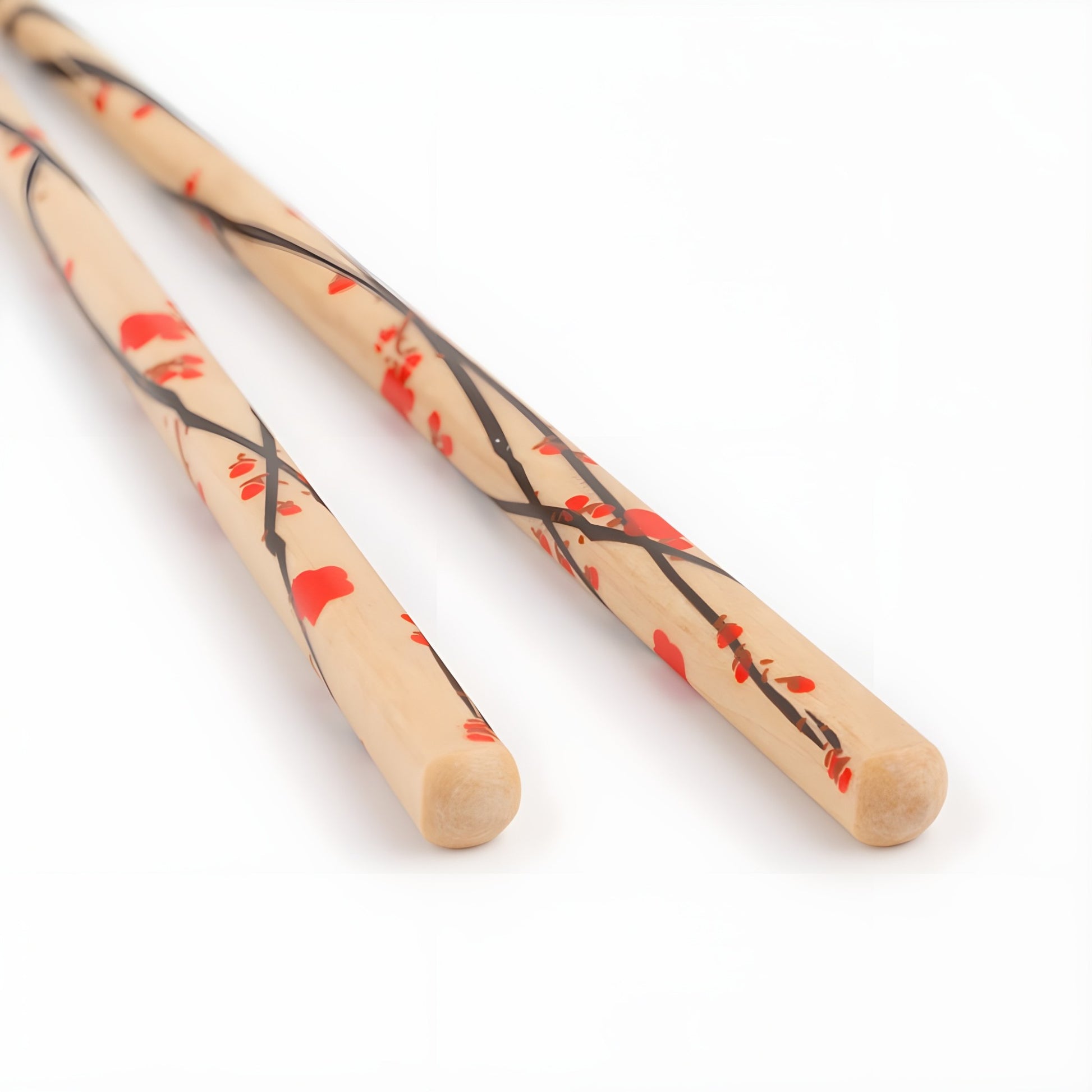 Close-up of natural wood chopsticks with a red plum blossom design, featuring black branches and red flowers, hand-painted for a traditional Japanese aesthetic.