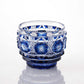 Indigo Satsuma Kiriko sake cup with traditional geometric and starburst designs.