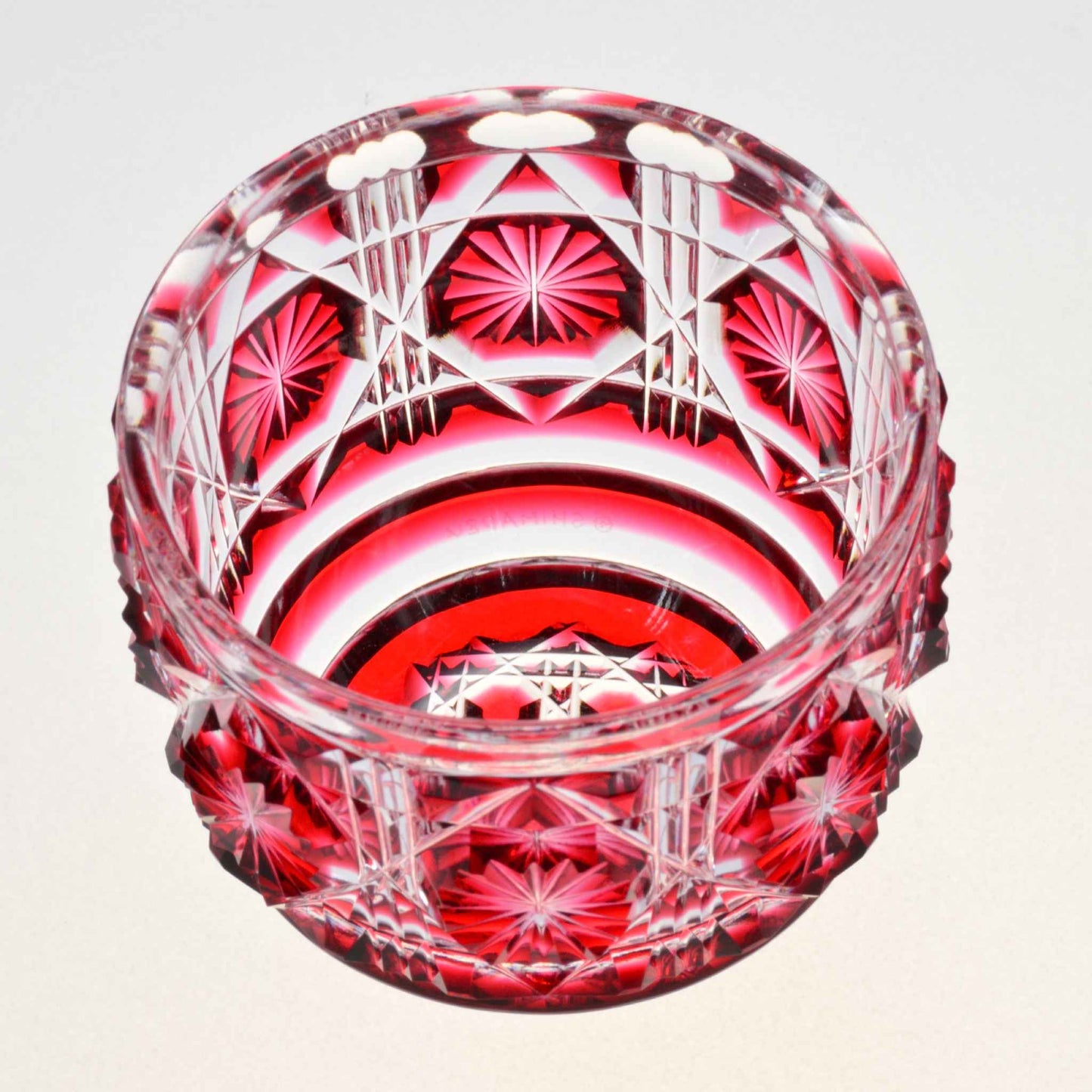 Exquisite red Satsuma Kiriko large sake cup with intricate hand-cut patterns.