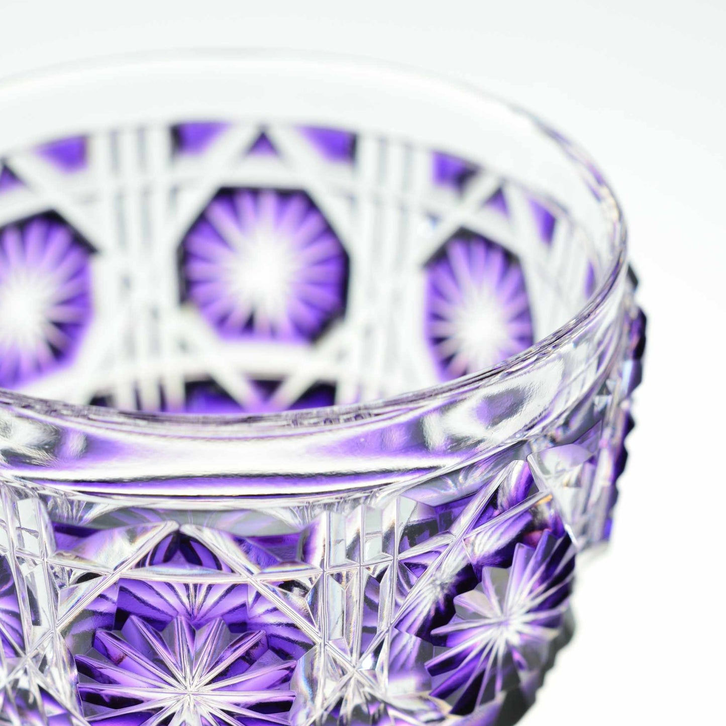 Close-up of Shimadzu Purple Satsuma Kiriko sake cup highlighting detailed craftsmanship.