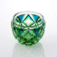 Cyan yellow green Satsuma Kiriko two-tone sake cup with geometric cut glass design.