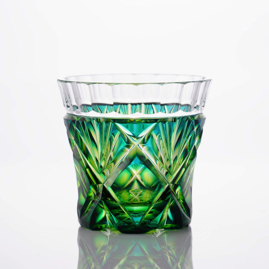 Standing view of Satsuma Kiriko two-tone sake cup in Cyan Yellow Green with clear upper rim and colored base.