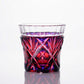 Full view of Satsuma Kiriko two-tone sake cup with a red and purple gradient and sharp, geometric designs.