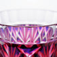 Close-up of Satsuma Kiriko two-tone sake cup showing detailed cut glass design with red and purple accents.