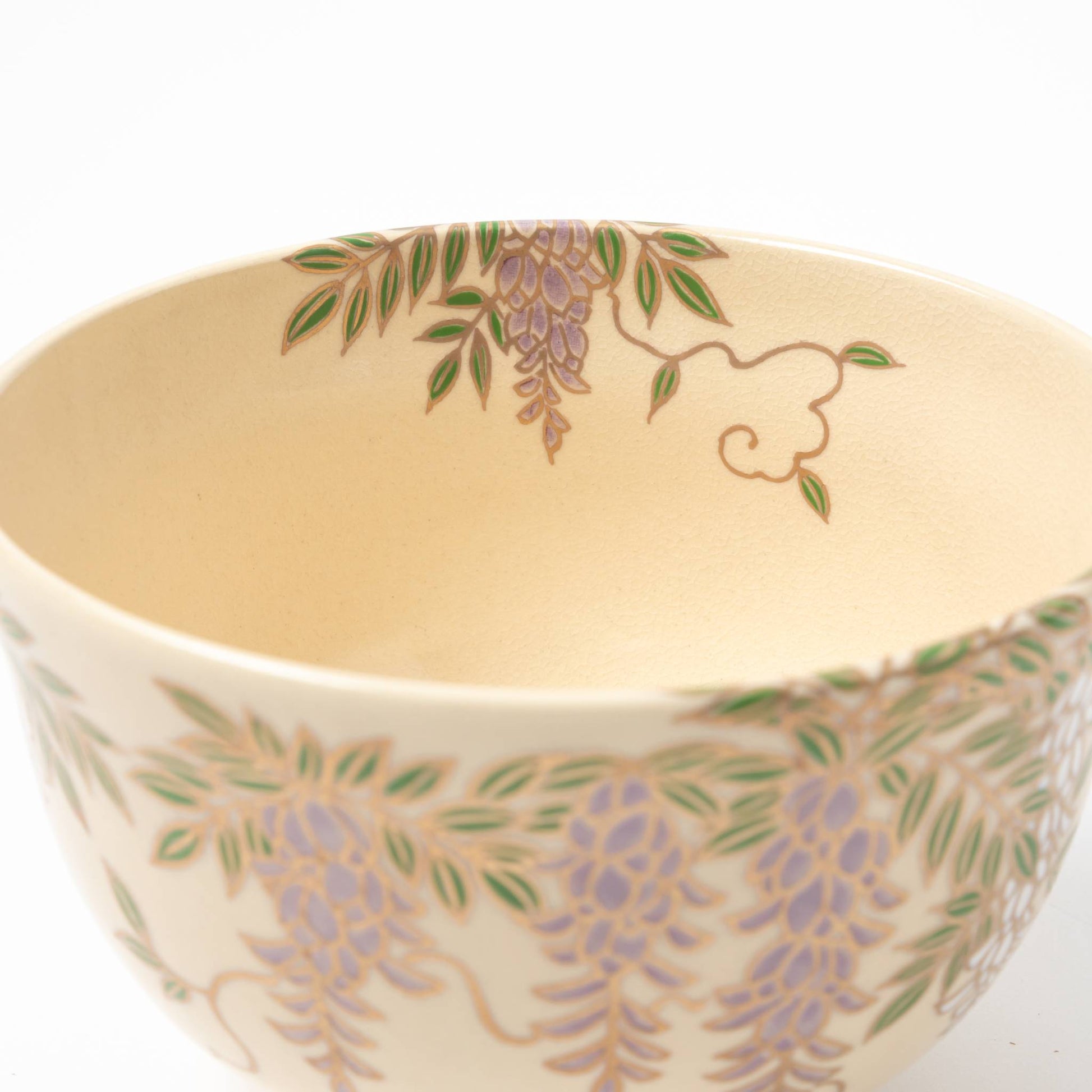 Close-up of the interior of a matcha bowl featuring a subtle wisteria design, showcasing the bowl's craftsmanship.