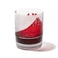 a red whiskey glass with an etched design of Mount Fuji and a textured landscape, representing the iconic Japanese mountain.