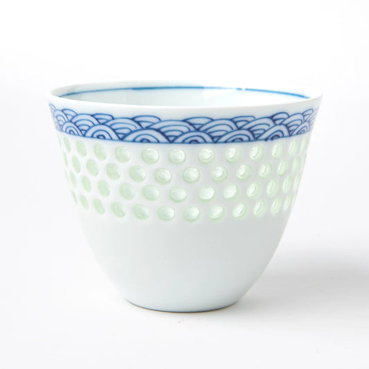 Tanshingama Crest Cup featuring a soft celadon dot texture and seigaiha wave pattern around the rim.