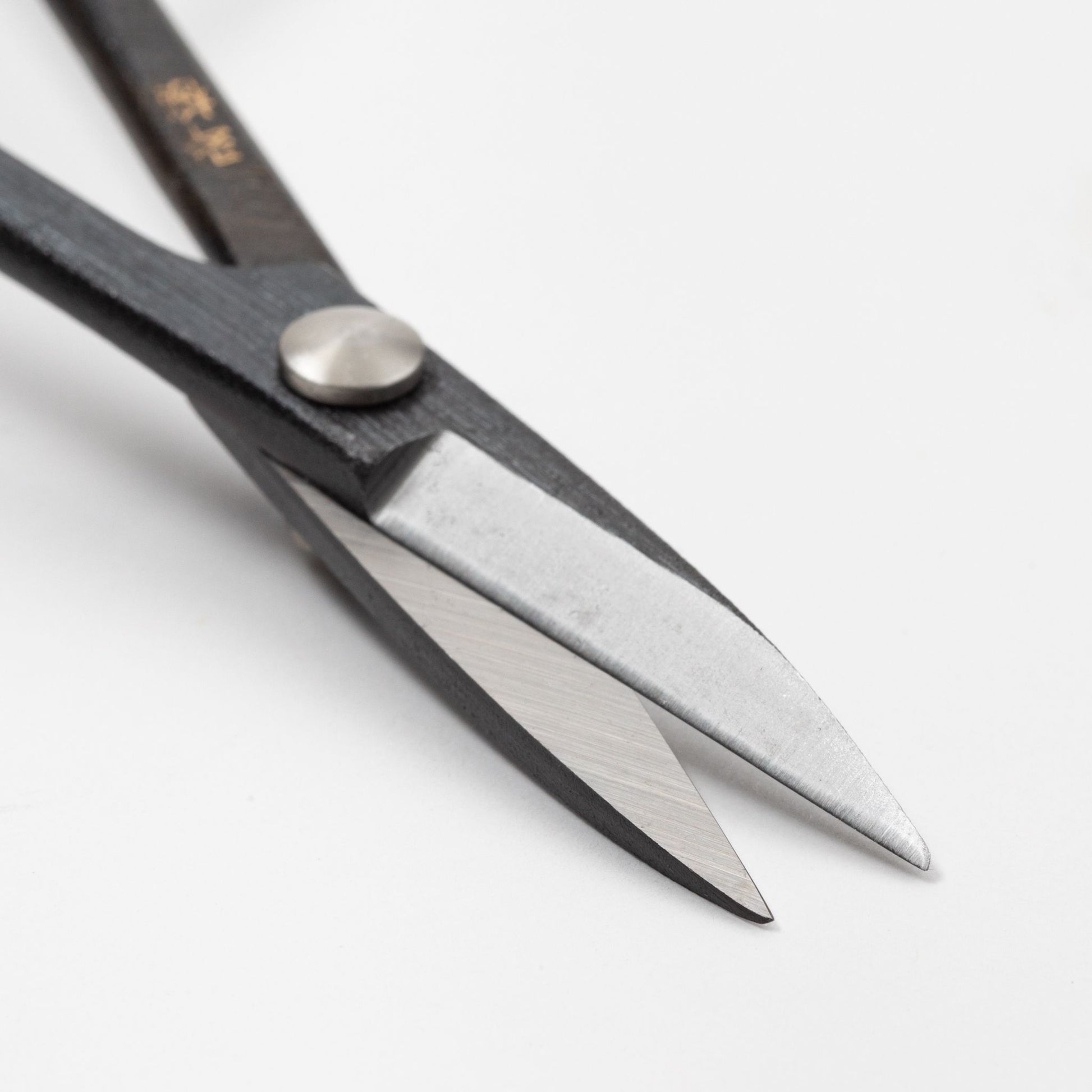 Close-up view of Tsurumaki Satsuki trimming shears, showcasing detailed craftsmanship and fine blade edge - specialized Japanese garden tool.