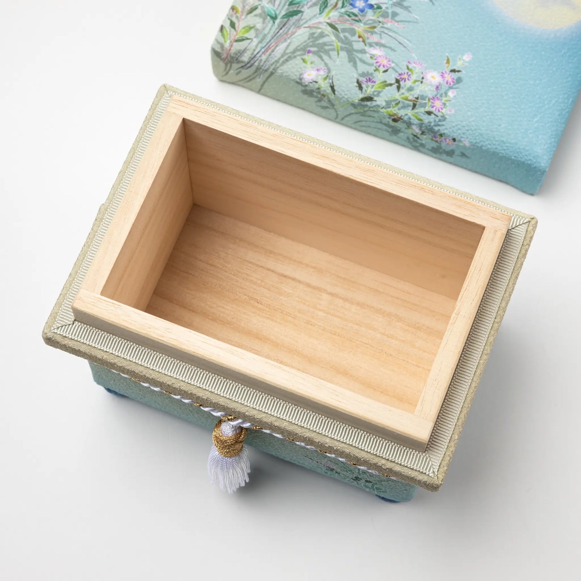 Opened view of the Kaga Yuzen Autumn Night Accessory Box, revealing a smooth wooden interior compartment, ideal for storing keepsakes.