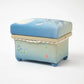Side view of the Kaga Yuzen Autumn Night Accessory Box, showing the delicate floral design in pastel colors, evoking a peaceful autumn scene.