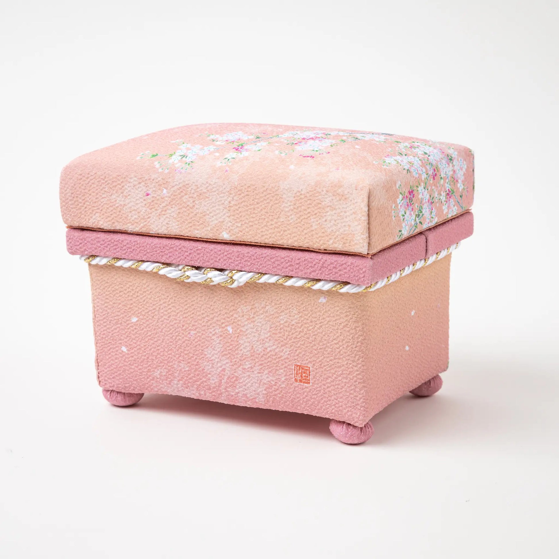 Back view of the hisatsune YUZEN Kaga Yuzen Sakura accessory box in pink, showcasing the brand mark and delicate sakura motif.