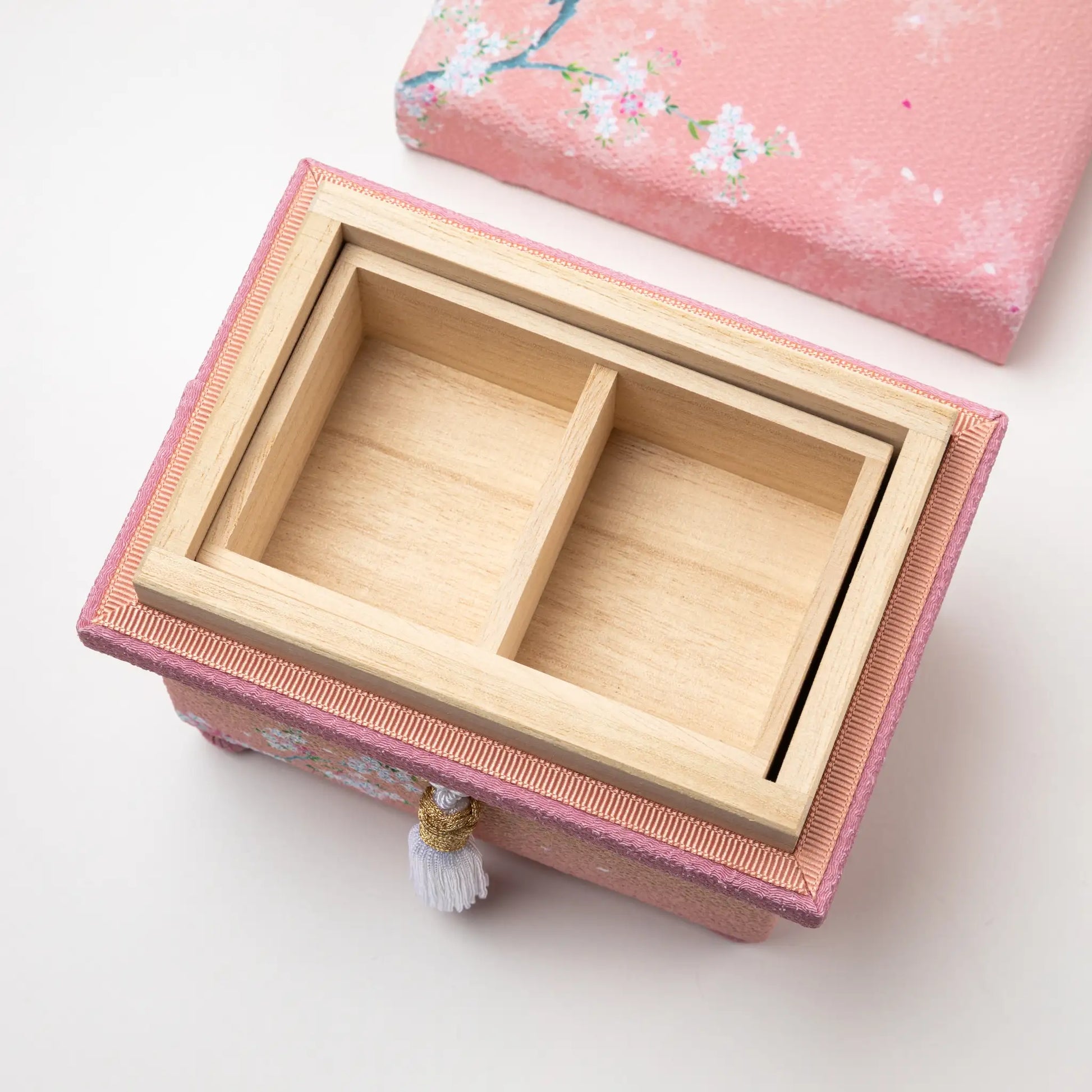 hisatsune YUZEN Kaga Yuzen Sakura accessory box with the lid open, revealing a divided wooden compartment for storing small items.