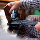 Wakasa Lacquerware aritisan paining the chopsticks